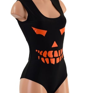 May include: Black sleeveless bodysuit with an orange jack-o'-lantern face graphic.