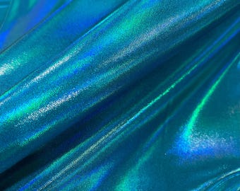 May include: Close-up of iridescent turquoise fabric with a subtle shimmer. The fabric has a smooth, silky texture and a slightly textured surface.