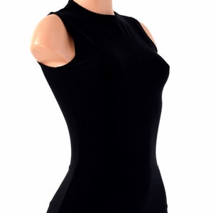 May include: A black sleeveless mock neck shirt. The shirt is fitted and has a smooth texture.