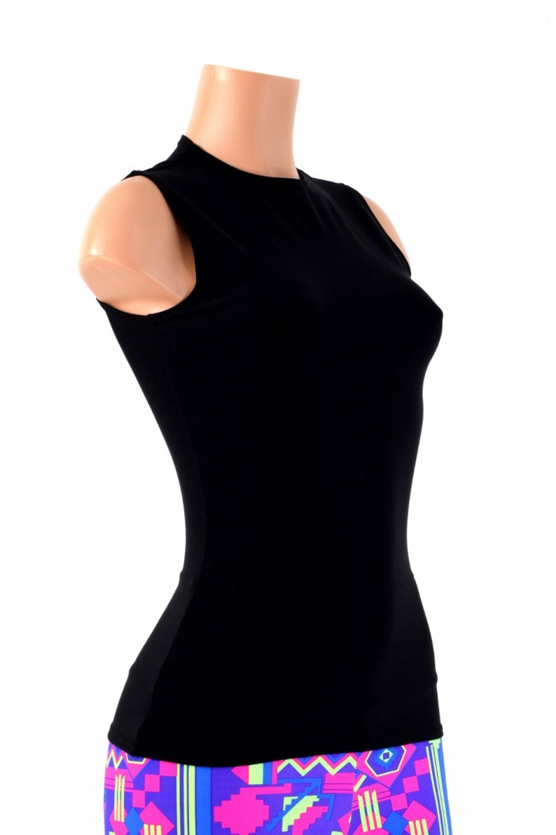 May include: A black sleeveless mock neck shirt. The shirt is fitted and has a smooth texture.