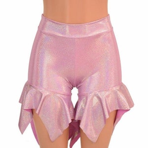 May include: Pink iridescent shorts with a ruffled hem. The shorts are made of a stretchy, shiny fabric.