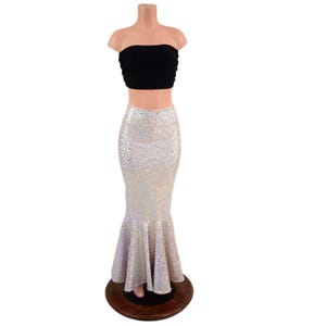 May include: A two-piece outfit consisting of a black strapless tube top and a floor-length, high-waisted mermaid skirt. The skirt features a shimmering, iridescent, scale-like pattern that reflects light with a metallic, silver-toned finish.