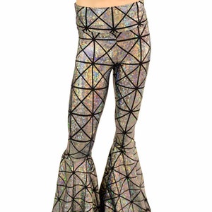 May include: Silver and black geometric patterned flared pants. The pants have a high waist and a wide leg.