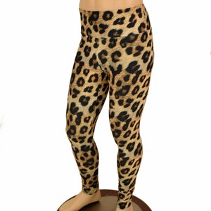 May include: Leopard print leggings in brown, black, and orange. The leggings are on a mannequin.