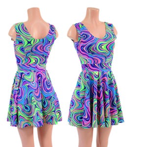 May include: Two sleeveless skater dresses with a vibrant, swirling pattern in shades of blue, purple, pink, and neon green. The dresses have a scoop neckline and a flared skirt, creating a playful and eye-catching design.
