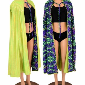 May include: A reversible cape with a lime green iridescent outer layer and a black, green, and purple swirl pattern on the inside. The cape has a high collar and ties at the neck.