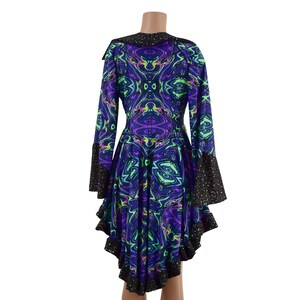 May include: A long-sleeved dress with a black trim and a swirling, psychedelic print in shades of purple, green, and black.