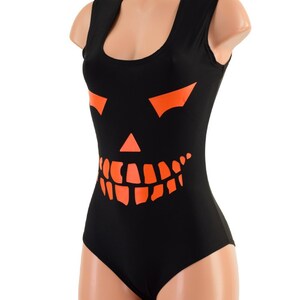 May include: Black sleeveless bodysuit with an orange jack-o'-lantern face graphic.