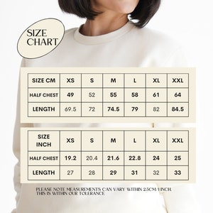 May include: Size chart for a sweatshirt in both centimetres and inches. The chart shows measurements for half chest and length in sizes XS, S, M, L, XL, and XXL.