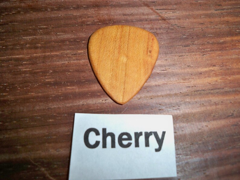 Cherry wood guitar pick image 1