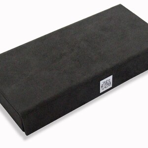 May include: A black rectangular box with a small white label that says "Giffords".