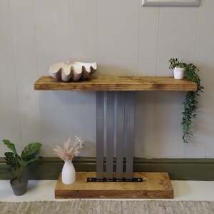 Console table with steel decorative centre