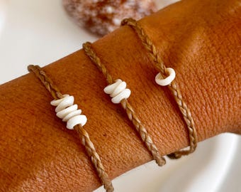 Customizable Hawaiian puka shell braided bracelet.