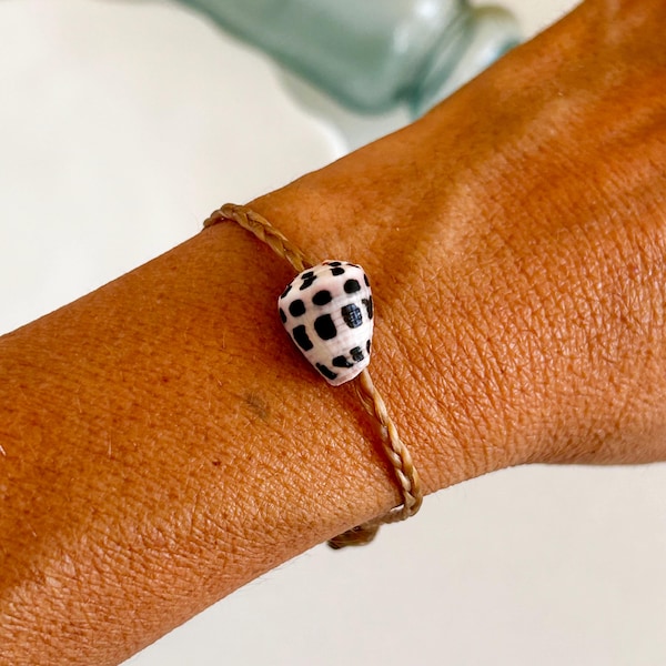 Customizable Hebrew cone shell braided bracelet.