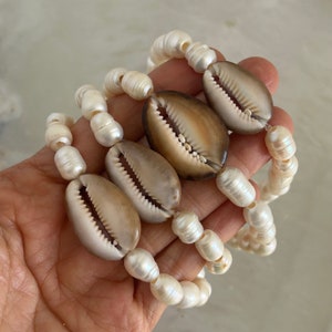 Custom fresh water pearl and Hawaiian cowry shell stretchy bracelet
