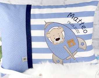 Personalized children's pillow for birth or baptism. With teddy and rocket in blue and white made of cotton fabric. Name pillow