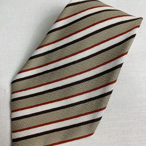 Vintage 1970's Wide Kipper Tie - Striped Crepe - Made in Malta  Jacquard Woven Polyester - Purple, Gold with Red and White