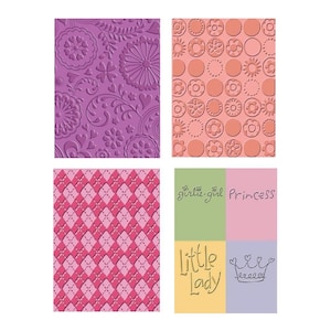May include: Four different patterned paper squares with text overlays. The top left square has a purple background with a floral pattern. The top right square has a peach background with a pattern of circles and flowers. The bottom left square has a pink background with a diamond pattern. The bottom right square has four squares with different colors and text. The top left square is green with the text "girlie-girl". The top right square is pink with the text "Princess". The bottom left square is yellow with the text "little Lady". The bottom right square is purple with a crown and the text "princess".