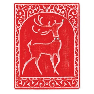 May include: A red and white Christmas card with a white reindeer silhouette in a decorative frame.