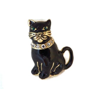 Vintage Monet Cat Brooch Black Enamel Rhinestone Collar Green Eyed Gold Tone Pin