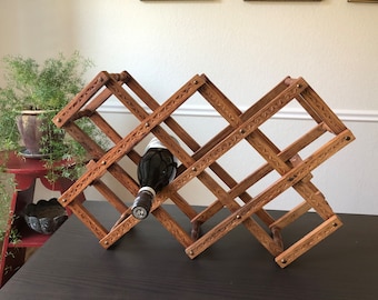 Vintage Accordion Rack Hand Carved Wooden Collapsible Wine Rack Folding Leaf Design Brown Brass Nails