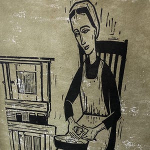 May include: A black and white woodcut illustration of a woman sitting in a chair, preparing food in a bowl. The woman is wearing a simple dress and a head covering. The illustration is set against a light green background.