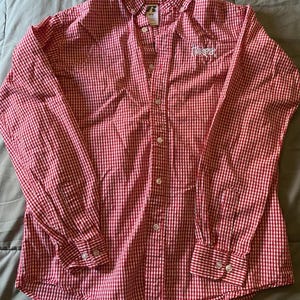 May include: Red and white checkered button-down shirt with long sleeves. The shirt has a classic collar and buttoned cuffs. The word "Threads" is embroidered on the chest.