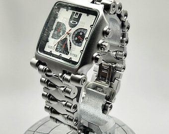 Oakley Inpired Minute Machine Acabado en acero inoxidable, reloj con esfera negra, fabricado en Suiza, Y2k.