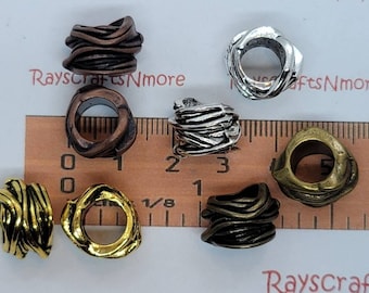 May include: Assortment of 10 metal bead caps in various finishes, including silver, gold, and copper. The bead caps are designed with a twisted wire pattern and have a hole in the centre for threading.