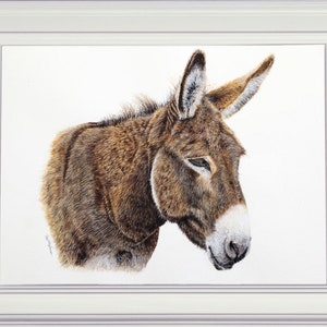 The donkey painting finished and displayed in a white frame.