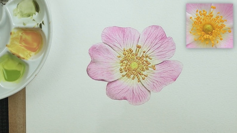 The petals look finished in this photo, with veins in a darker shade of pink.  The centre is painted yellow, but is not finished.