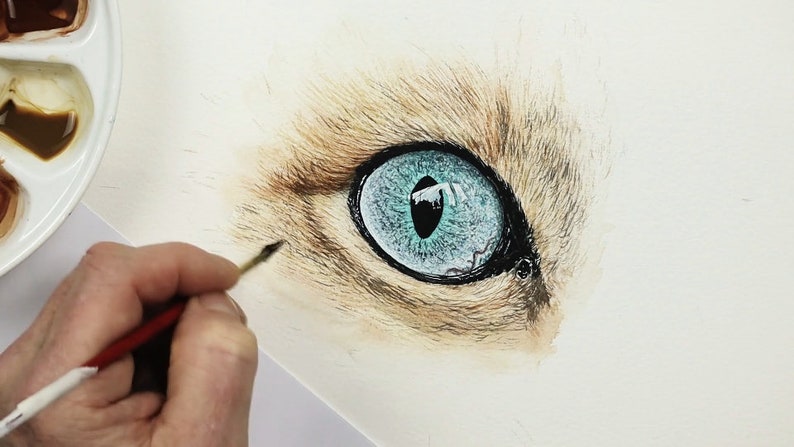 Paul is painting the tabby fur in this photo, and the eye suddenly has a context.  The fur makes the eye look even more real, even though it isn't finished yet.