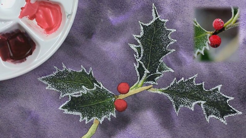 The sprig of leaves is now painted and complete, and Paul is working on the bright red berries.  He has applied a bright wash to both fruits, and has some darker paint in the palette shown on the left.