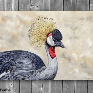 The crane painting displayed on a grey wood panelled wall.