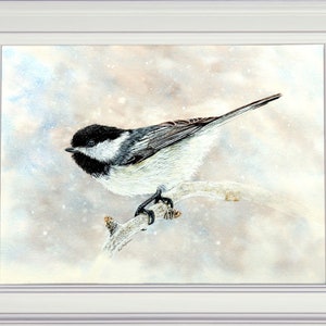 The completed chickadee painting in a white frame.