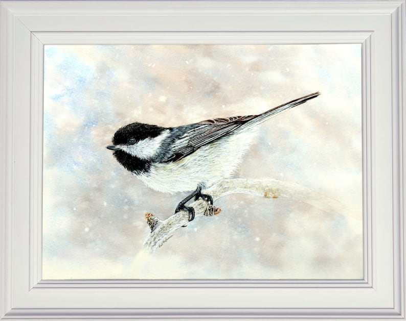 The completed chickadee painting in a white frame.