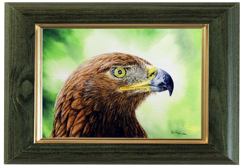 The original artwork in a green frame with a gold trim.