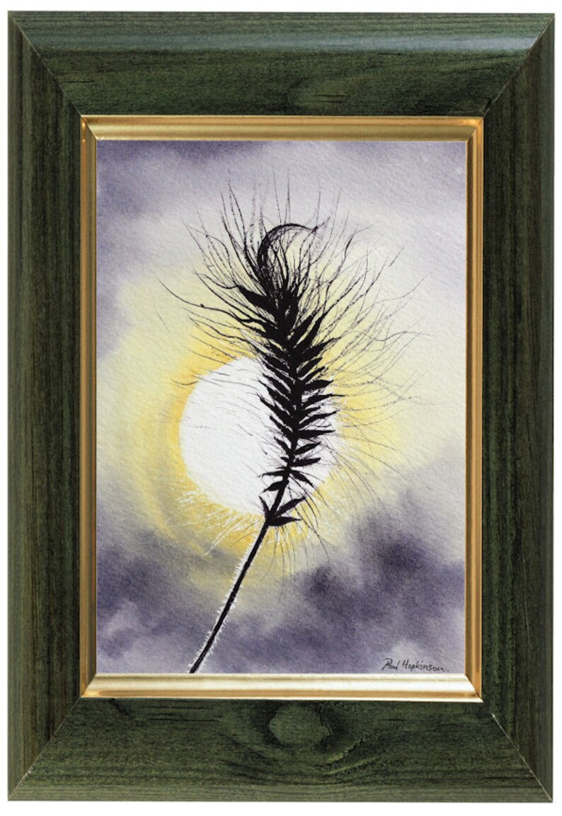 The grass painting in a green frame with a gold inner trim.