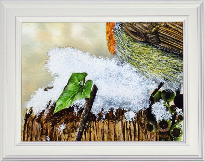 The snowy section of the painting shown in a white frame.