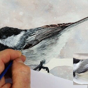 The bird is really coming together in this photo, with the head, wings and tails completed.  Paul is working on the belly, he has applied grey wash layers and details so far.