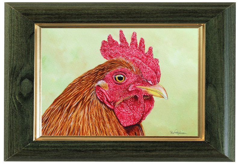 The cockerel painting in a green frame with agold inner trim.