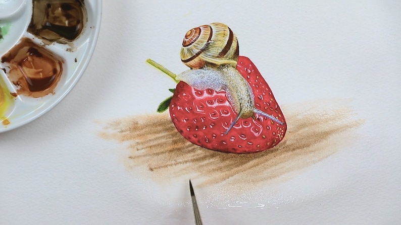 The snail and strawberry are fully painted, and Paul is adding a suggestion of a piece of wood under everything using a larger brush and applying streaks of various browns.