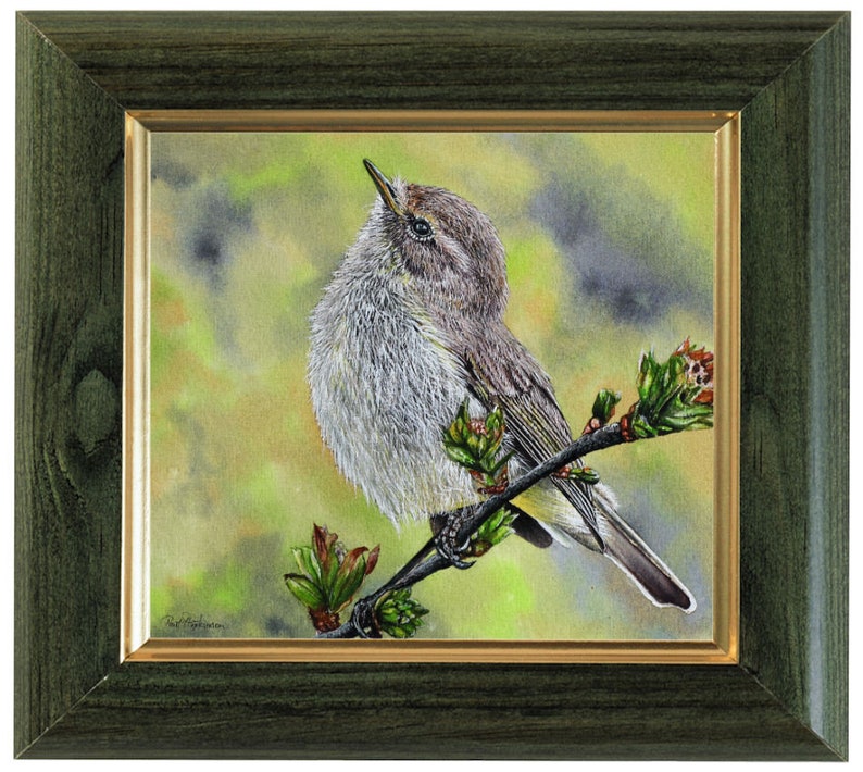 The bird painting in a dark green frame with a gold inner trim.