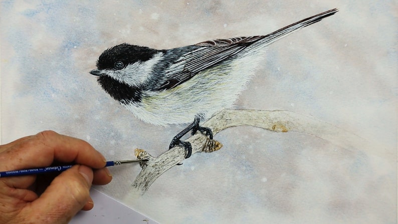 The bird is now painted and Paul is working on the little branch that it is perched on.  This has some pale brown details added on it so far.