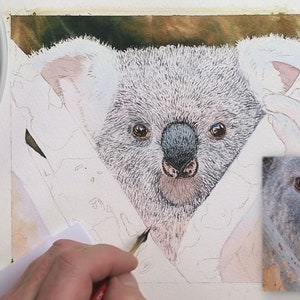 In this photo, Paul is adding the first layer of grey fur detail to the animal's face and chest.  He is working with a split-haired brush.