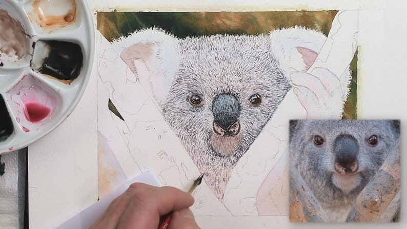 In this photo, Paul is adding the first layer of grey fur detail to the animal's face and chest.  He is working with a split-haired brush.