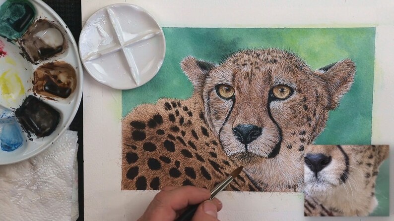 The painting is nearing completion, as Paul adds the white fur and highlights around the head.