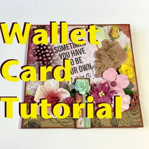 Op de afbeelding: Een handgemaakte wallet card tutorial met de woorden "Wallet Card Tutorial" in gele blokletters. De kaart is versierd met diverse bloemen in tinten roze, paars en geel, en bevat de tekst "Sometimes you have to be your own hero."