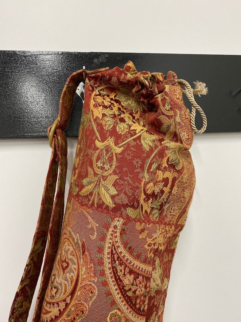 Yoga mat bag handmade in deep rich red and gold fabric Includes adjustable strap /& pocket.