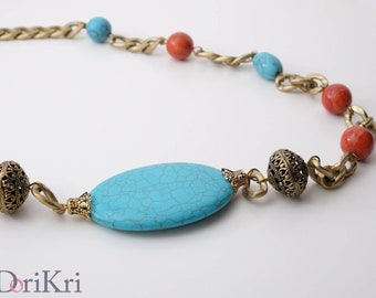 Turquoise blue stone necklace. Golden chain interspersed with corals and turquoise.